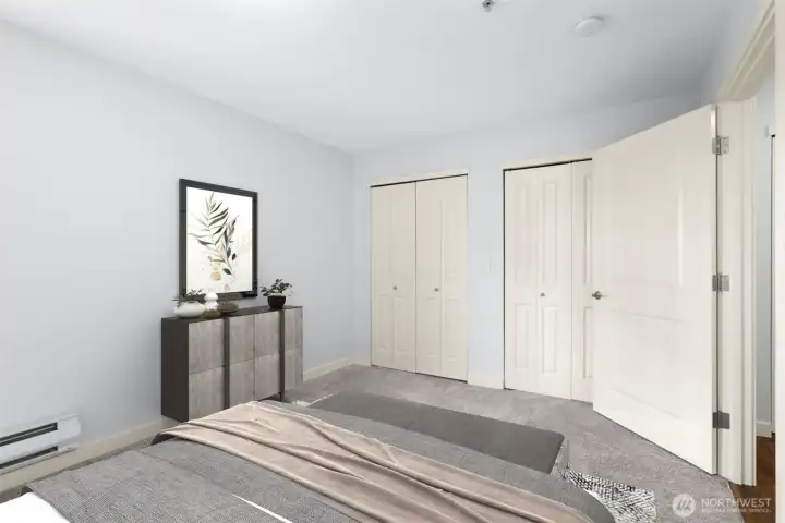 Second bedroom. The entire east-facing wall features double-doors to a closet with built-ins