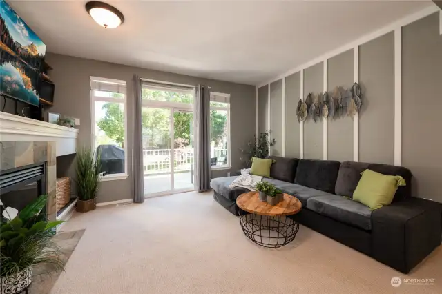 Enjoy a spacious living room with access to outer deck.