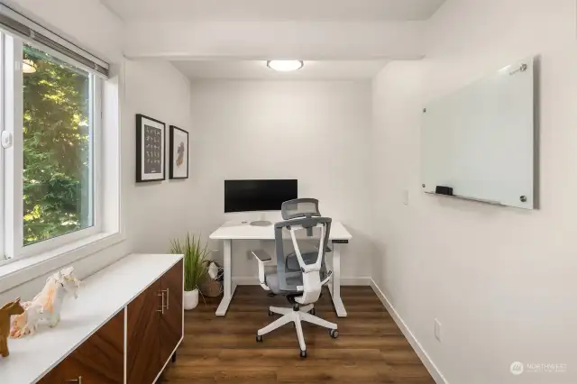 Home office set up with a large window to keep the space light and airy!