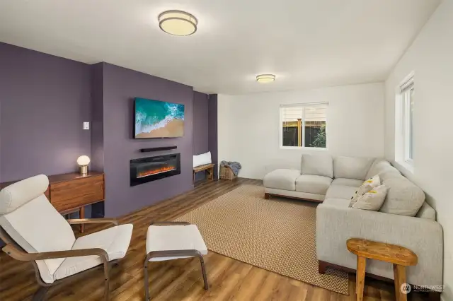 Lower level boasts a bonus room with an electric fireplace perfect for movie or game night or can be repurposed for a home gym, office or more!