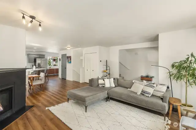 Alternate view of living room highlighting open floor plan. Gas fireplace for comfort and coziness!