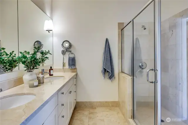 Ensuite Bath features Double Sink Vanity, Glassed in Tiled Shower.