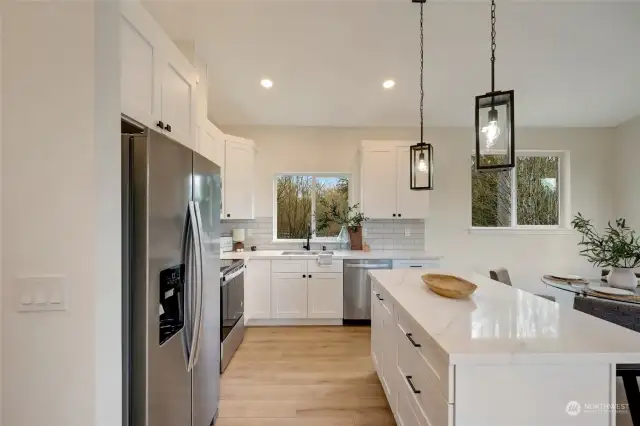 Beautiful Kitchen with stainless appliances including Fridge.