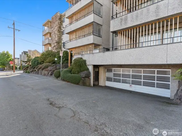 Secure parking garage with 1 parking space and a storage closet.