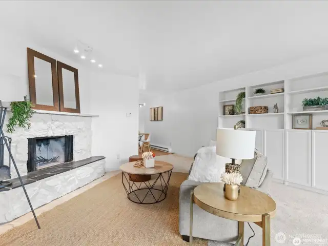 Wood burning fireplace and built in cabinets in the living room.