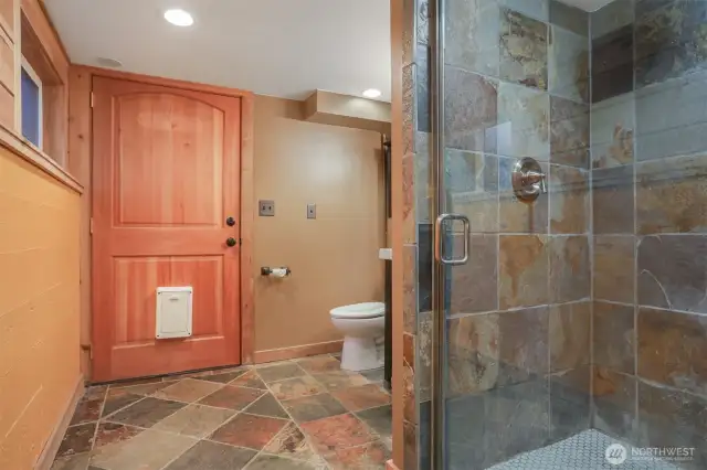 Main (South) home lower level remodeled tiled 3/4 bathroom with heated floors.   Has a separate entry, great income opportunity via vacation rental, housemate, etc.