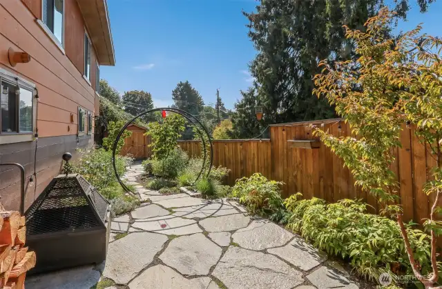 Professionally landscaped west side courtyard with privacy fencing.