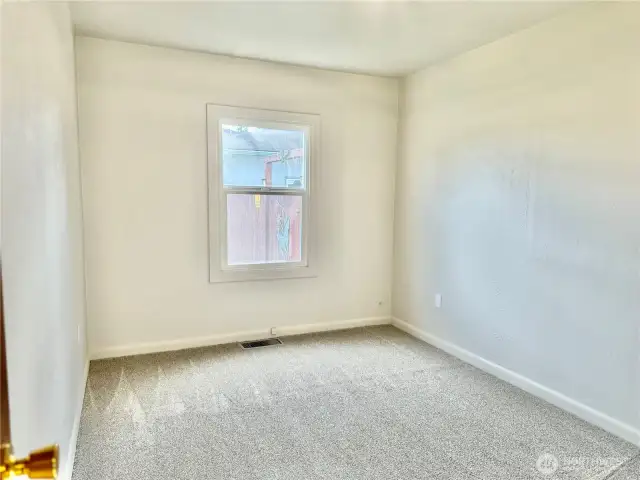 Bedroom #1 with built in closet and drawers.