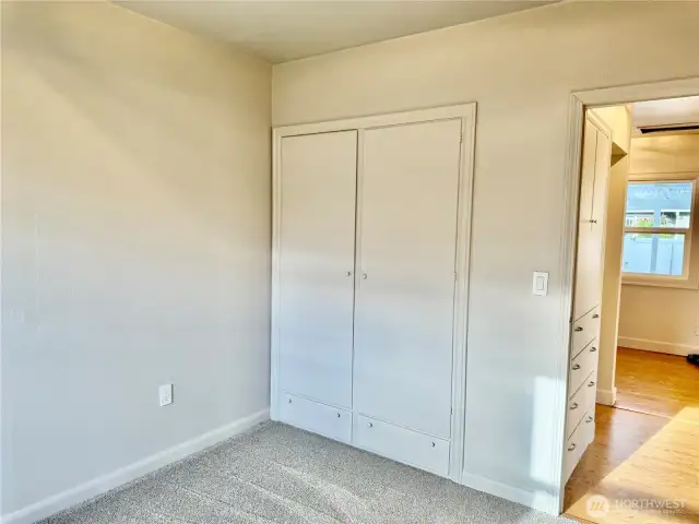 Bedroom #1 with built in closet and drawers.