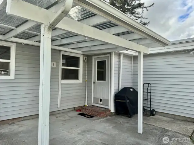 Covered patio accessed through back door.