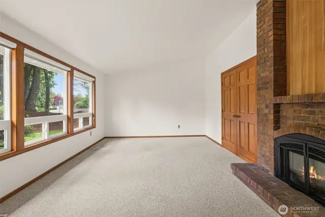 Vaulted den with gas fireplace.