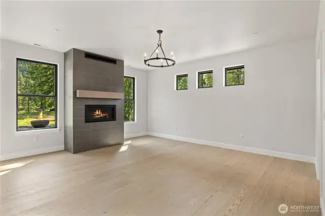 Primary bedroom with ornate gas fireplace.