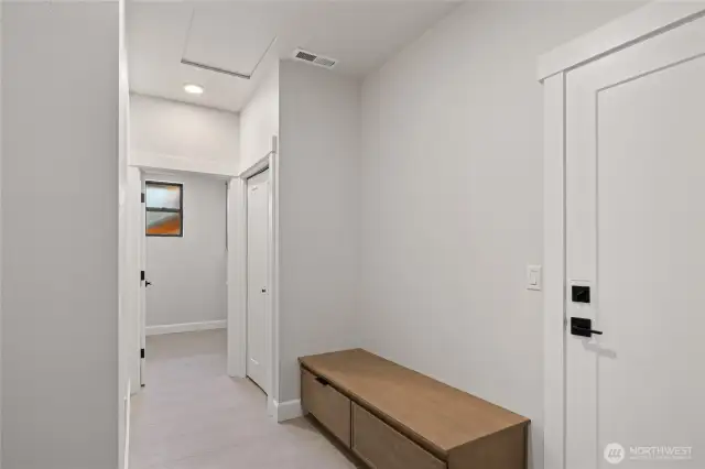 Laundry room with built in bench, and laundry sink.
