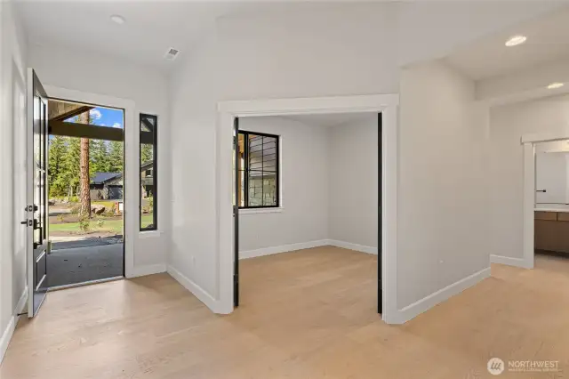 The study located by the entry with front window view.
