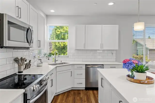 Stainless Steel appliances, quartz countertops, and soft close cabinets.