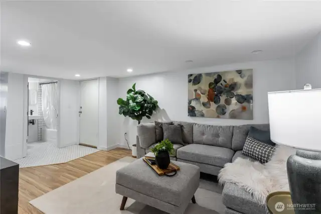 Downstairs area with an entrance door to the back of the house.  May make a great ADU or MIL suite.