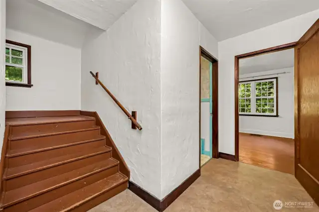 One spacious bedroom and 1 full bath on the main level. Staircase to the upper 2 bedrooms seen here.