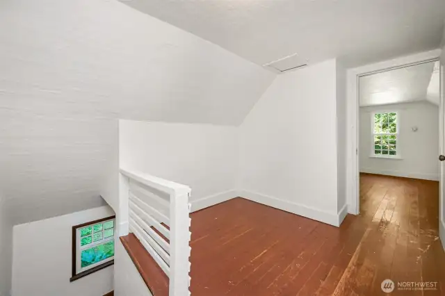The upper landing where two additional bedrooms are accessed on either side.