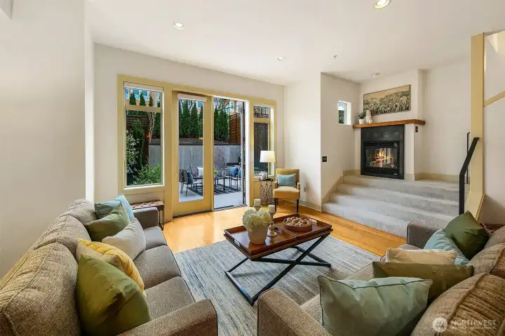 Cozy fireplace and French doors to patio