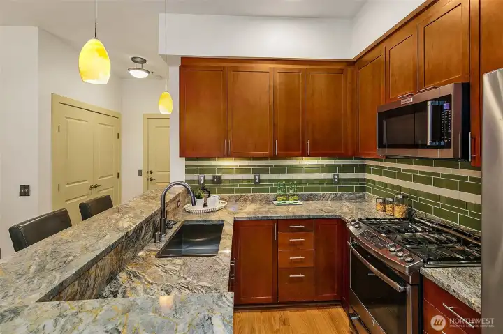 Stunning granite counter tops and stainless appliances