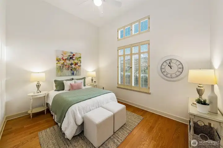 2nd bedroom has vaulted ceiling, huge windows and ceiling fan