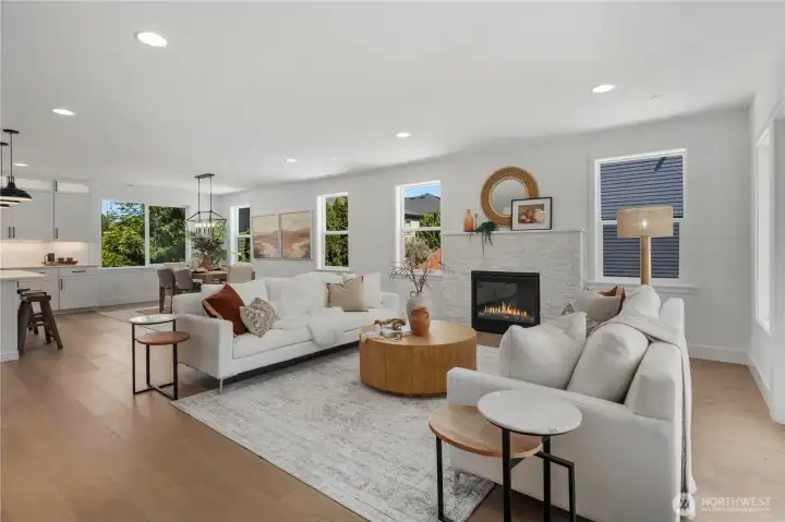 Great Room View Two: Cozy yet open living area anchored by a striking fireplace and surrounded by natural light. Perfectly designed to flow into the dining and kitchen areas for comfortable Eastside living.  Staged photos are of the model home of the same floorplan within the Foxmoore community and are for visualization purposes only. Colors, finishes, and layout can and will vary.