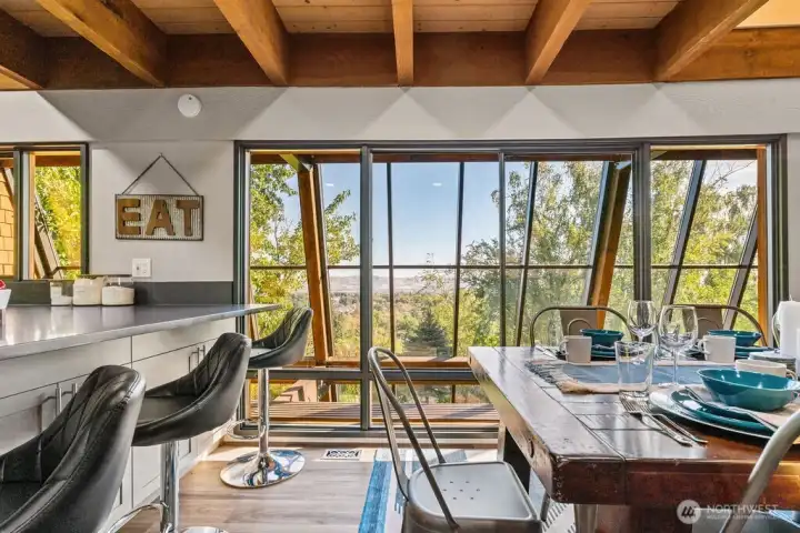 This spacious dining area offers breathtaking, expansive vistas of the picturesque Yakima Valley, creating an unparalleled dining experience with its continuously captivating scenery.