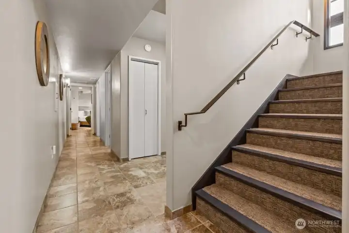 Lower level which includes 2 bedrooms, bathrooms, laundry and bonus living areas