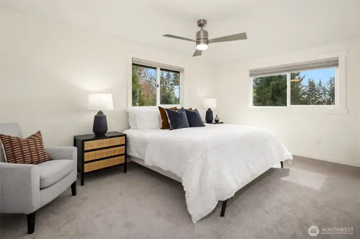 Large primary bedroom with attached 3/4 bathroom.