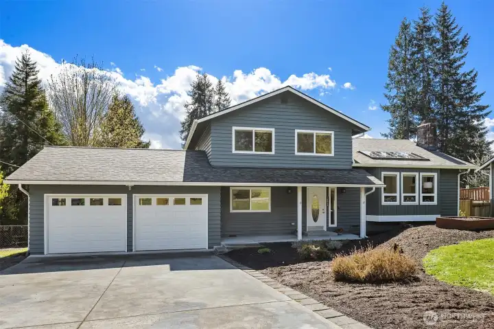 2 car attached garage plus lots of off-street parking. Room for RV/Boat in gravel are to the left.