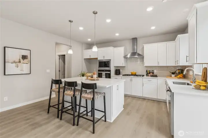 Chefs kitchen features gas cooking and tons of cabinet storage, soft close and dovetail drawer construction.Photo's are for representational purposes only. Colors and finishes may differ.