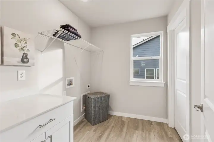 Laundry and mechanical room with operational window