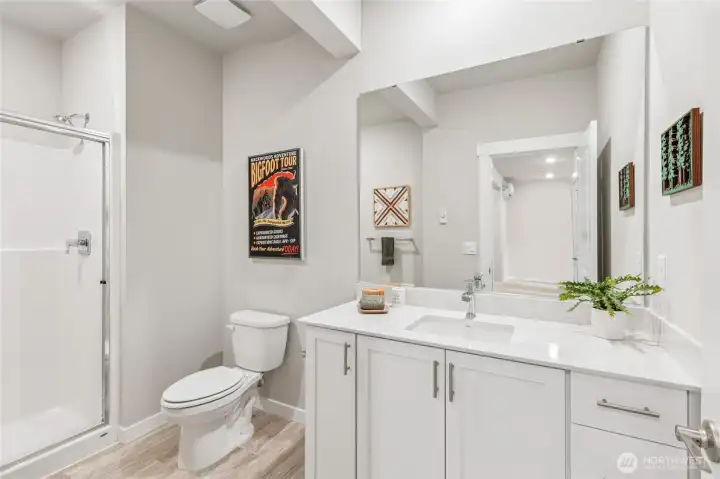 Spacious lower level bathroom. Photo's are for representational purposes only. Colors and finishes may differ.