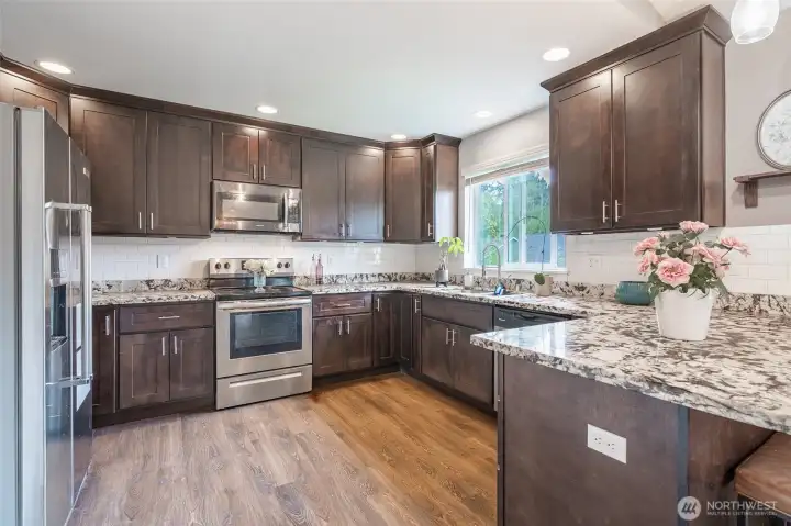 Open, large kitchen with pantry and granite countertops
