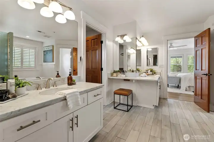 The spa-inspired primary bath features dual vanities and thoughtful amenities.