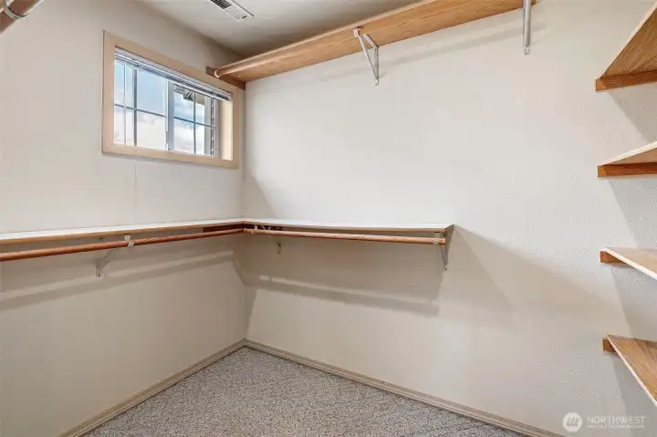 Dual walk-in closets provide exceptional storage and organization. . .