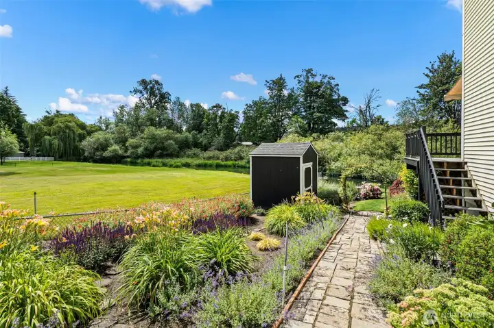 Meticulously maintained gardens provide vibrant color, seasonal interest, and space to grow your own vegetables.