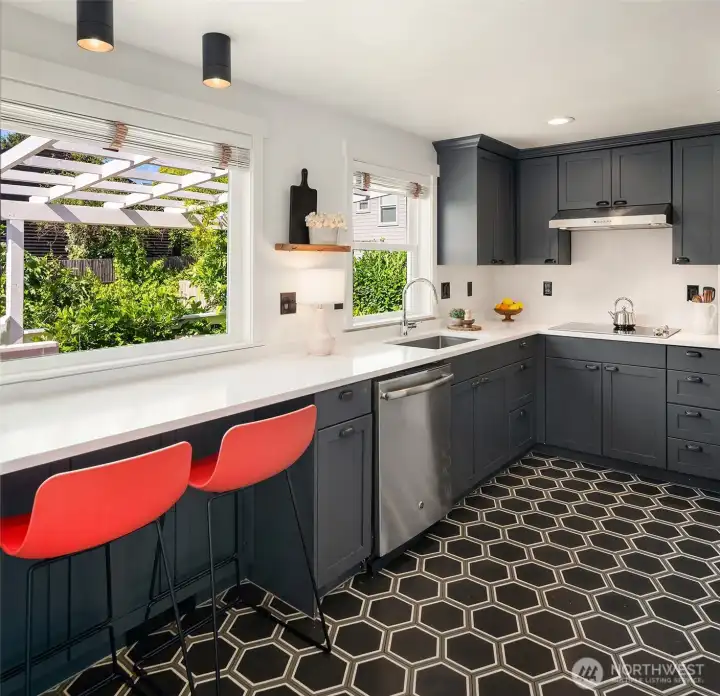 Enjoy peaceful mornings at the kitchen bar, watching the birds in your backyard.