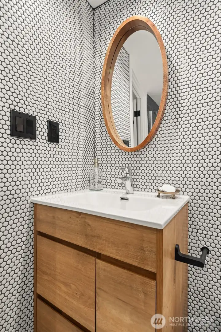 Lovel lower full bathroom is quite sassy with the tile work.