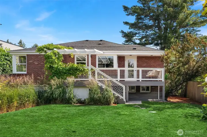 Fully fenced sunny, and private backyard, has room for yard games, a kitchen garden and comes with fruit trees!