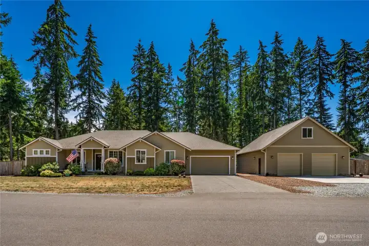 Beautiful front view of this spacious Graham rambler with detached shop, generous driveway space, and a peaceful tree-lined setting. Beautiful front view of this spacious Graham rambler with detached shop, generous driveway space, and a peaceful tree-lined setting.