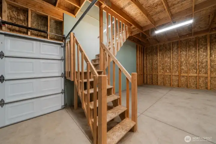 Shop staircase leading to additional upper-level storage, adding even more function to the detached shop. Shop staircase leading to additional upper-level storage, adding even more function to the detached shop.