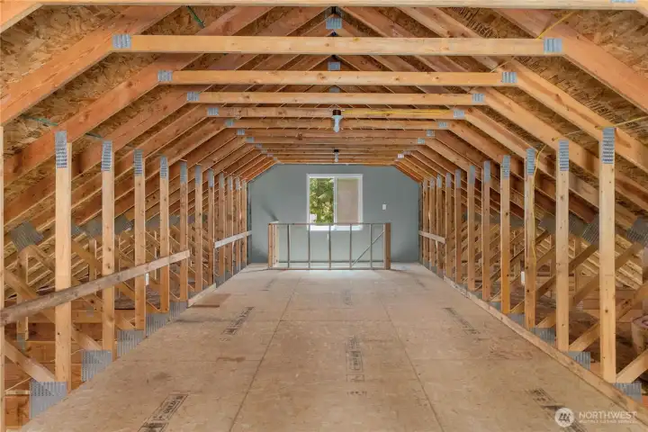Spacious loft area above the detached shop, providing valuable bonus storage with window light and easy stair access. Spacious loft area above the detached shop, providing valuable bonus storage with window light and easy stair access.