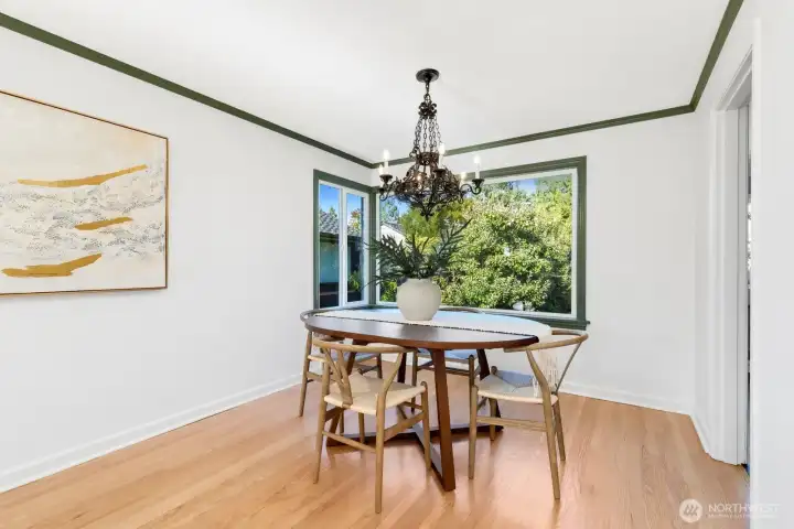 The newly refinished hardwoods really shine in the dining area. Those big windows overlook the back patio and yard. The newly refinished hardwoods really shine in the dining area. Those big windows overlook the back patio and yard.