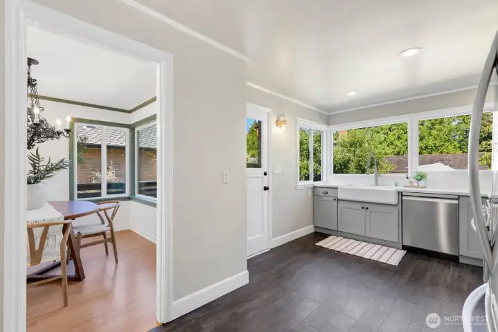 The updated kitchen has direct access to the back patio and yard. The updated kitchen has direct access to the back patio and yard.