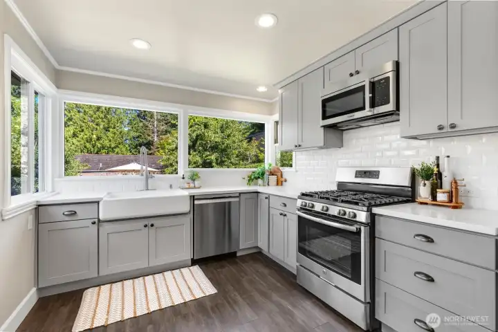 Kitchen was classically remodeled in 2018. Those windows look directly into the greenery in the backyard. Kitchen was classically remodeled in 2018. Those windows look directly into the greenery in the backyard.