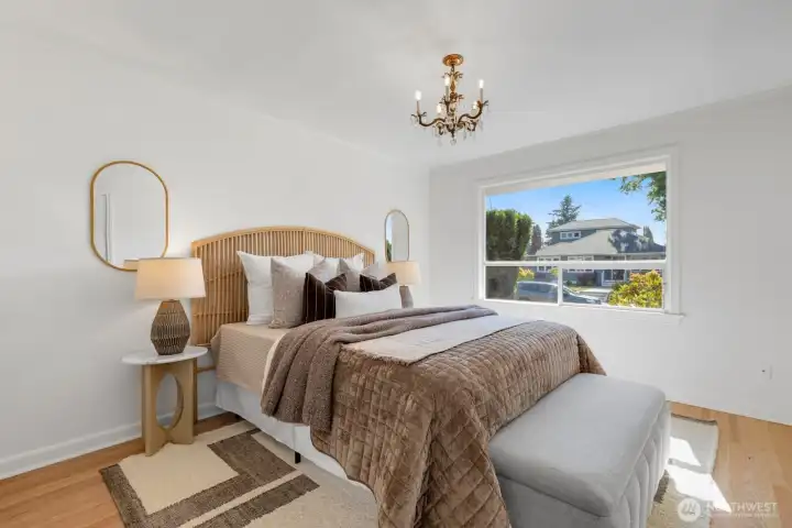 The front bedroom easily fits a king-size bed and sits in the SW corner of the home. The front bedroom easily fits a king-size bed and sits in the SW corner of the home.
