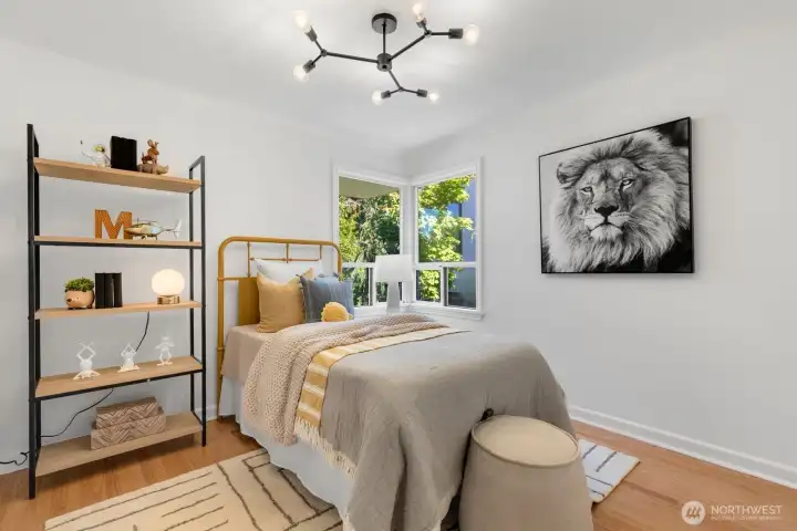 The second of two bedrooms on the main floor. This bedroom overlooks the backyard. Love a room with a corner window! The second of two bedrooms on the main floor. This bedroom overlooks the backyard. Love a room with a corner window!
