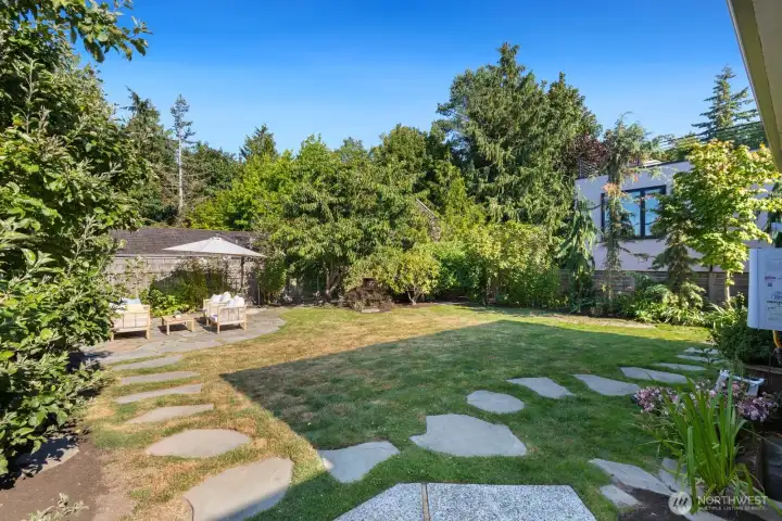 The back patio is calling for a firepit and sits close to the hot tub. The back patio is calling for a firepit and sits close to the hot tub.