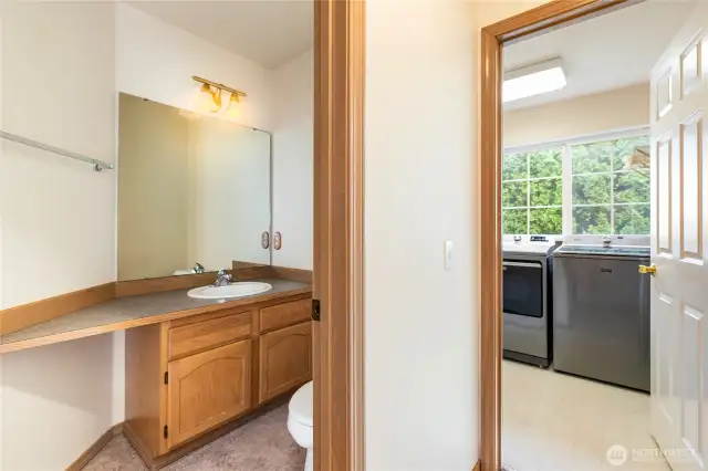 1/2 bath off the kitchen looking into the laundry